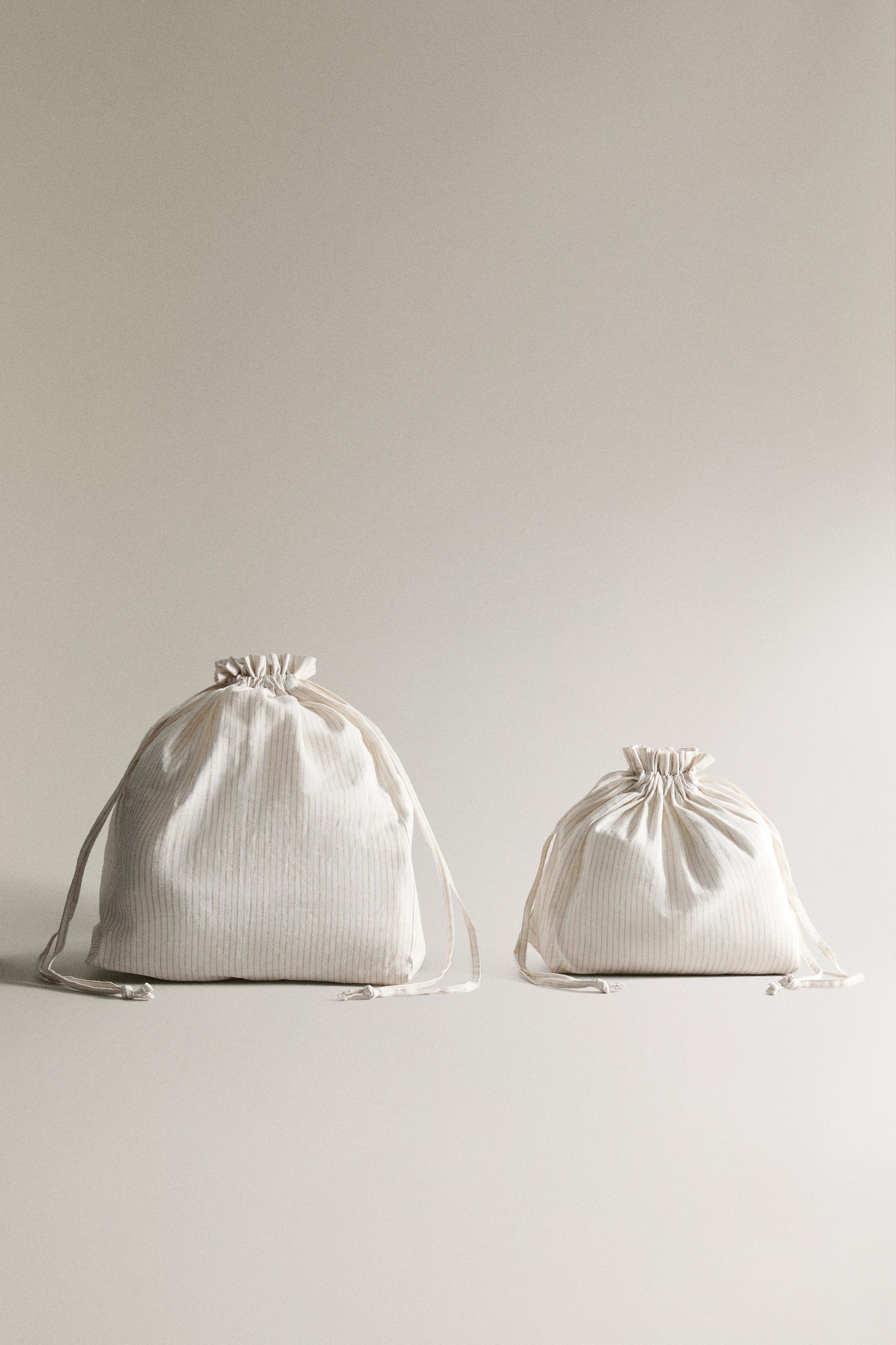 STRIPED BAG WITH DRAWSTRING CLOSURE